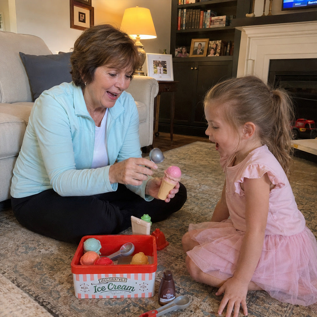 A grandmother sitting on the living room floor playing with her young granddaughter.