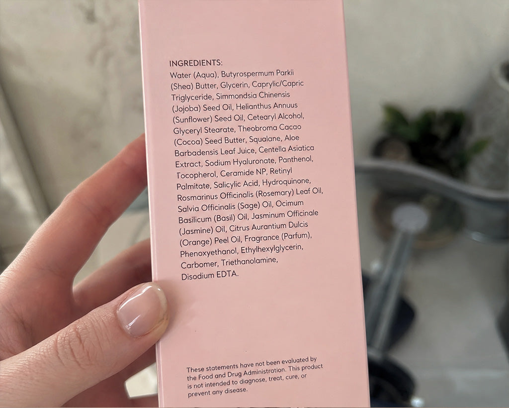 Reading the ingredient list on the back of the bottle